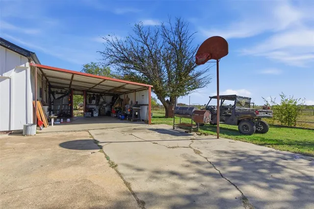 a view of a yard with large trees