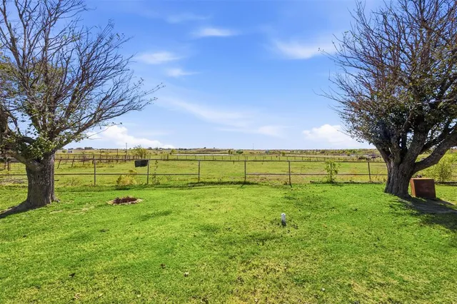 a view of a lake and a yard