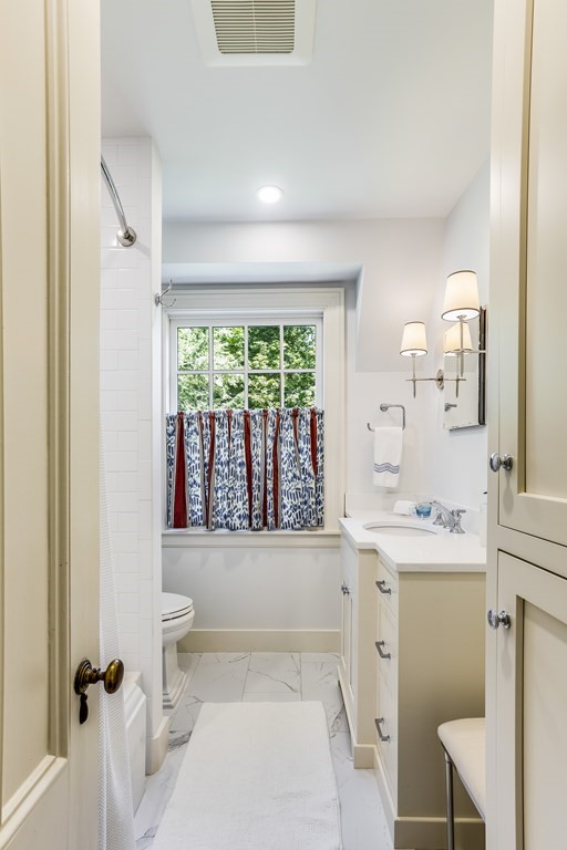 39 Musketaquid Road Concord, MA 01742 - Photo 34 of 40 a bathroom with a sink toilet and tub