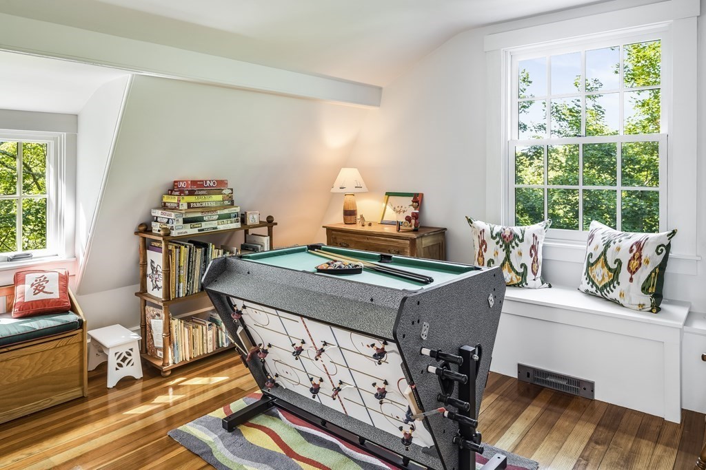39 Musketaquid Road Concord, MA 01742 - Photo 36 of 40 a living room with a bed furniture and a large window