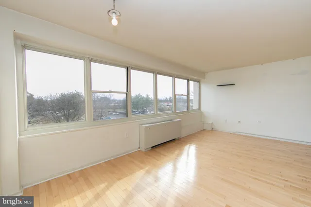 a view of an empty room with a window