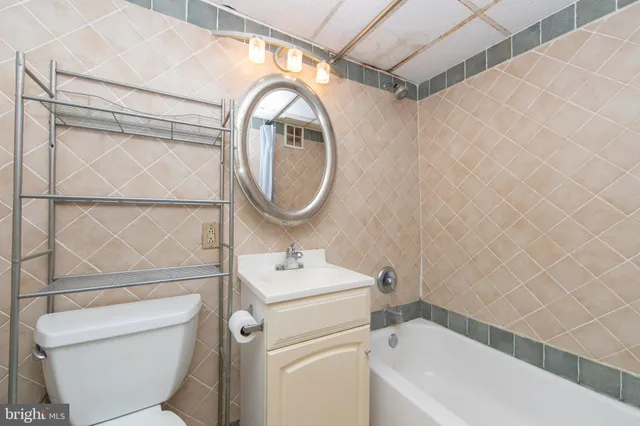 a bathroom with a toilet a sink and a bathtub