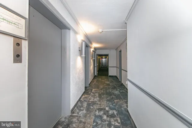 a view of hallway with wooden floor