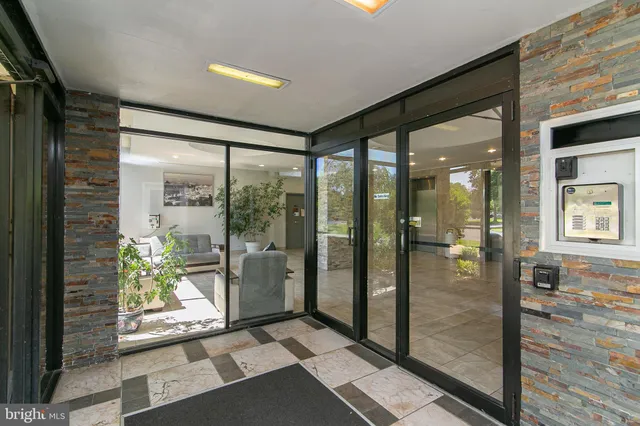 a bathroom with a glass door shower and a bathtub