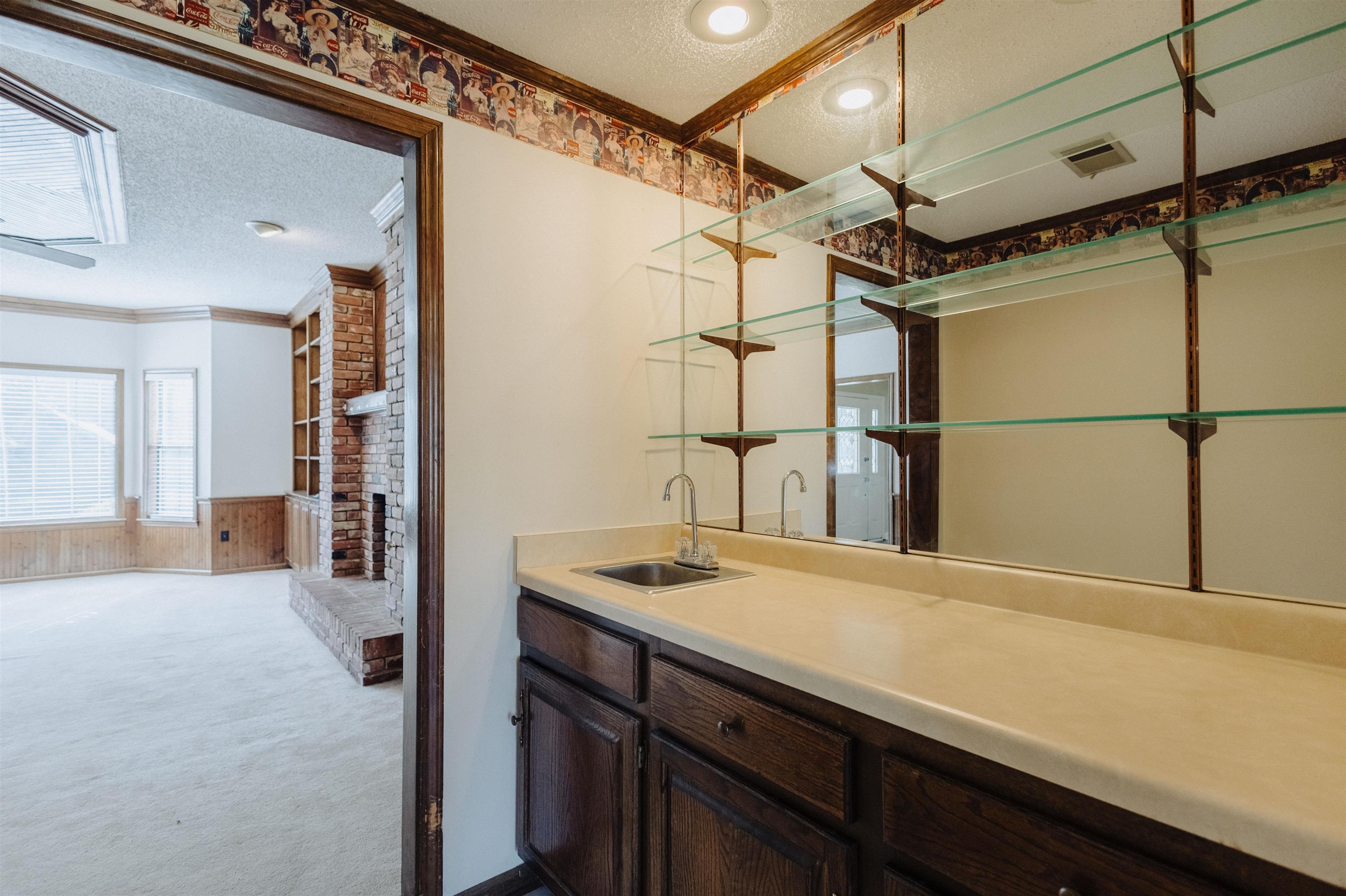 2375 Cherry Spring Cove Memphis, TN 38016 - Photo 11 of 33 a bathroom with a sink and a mirror