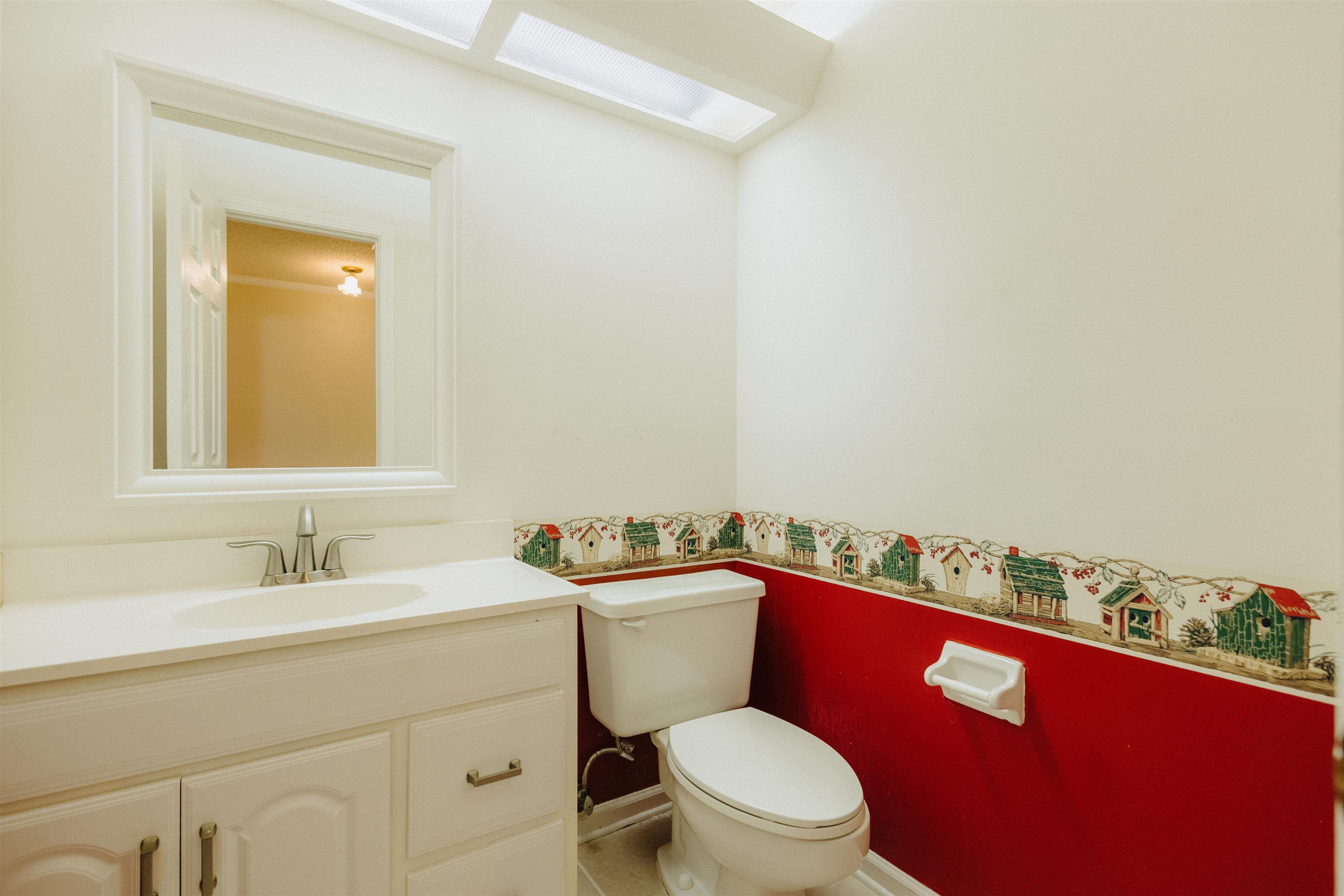 2375 Cherry Spring Cove Memphis, TN 38016 - Photo 12 of 33 a bathroom with a granite countertop toilet sink and mirror