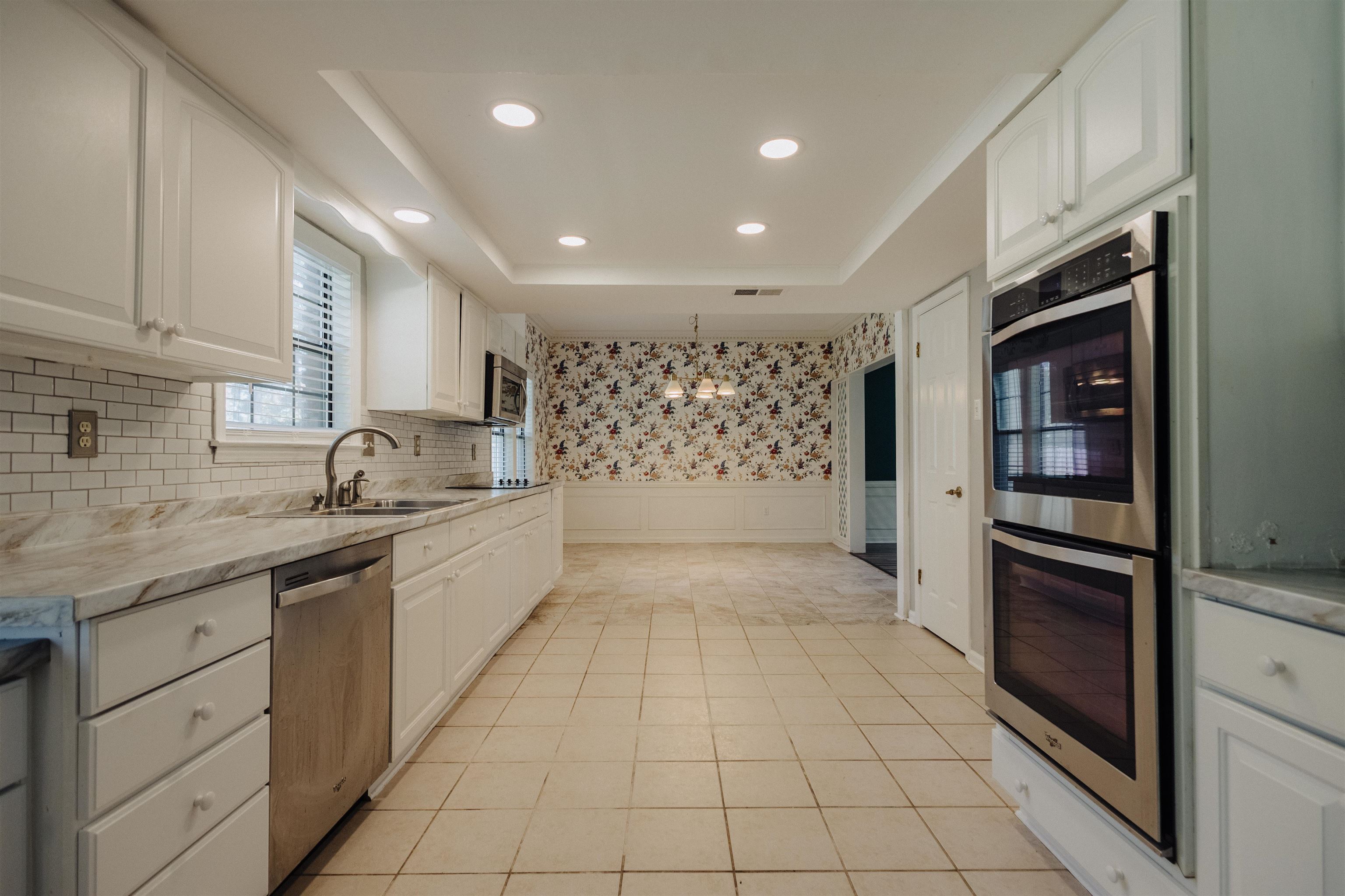 2375 Cherry Spring Cove Memphis, TN 38016 - Photo 15 of 33 a large kitchen with stainless steel appliances granite countertop a refrigerator and a sink