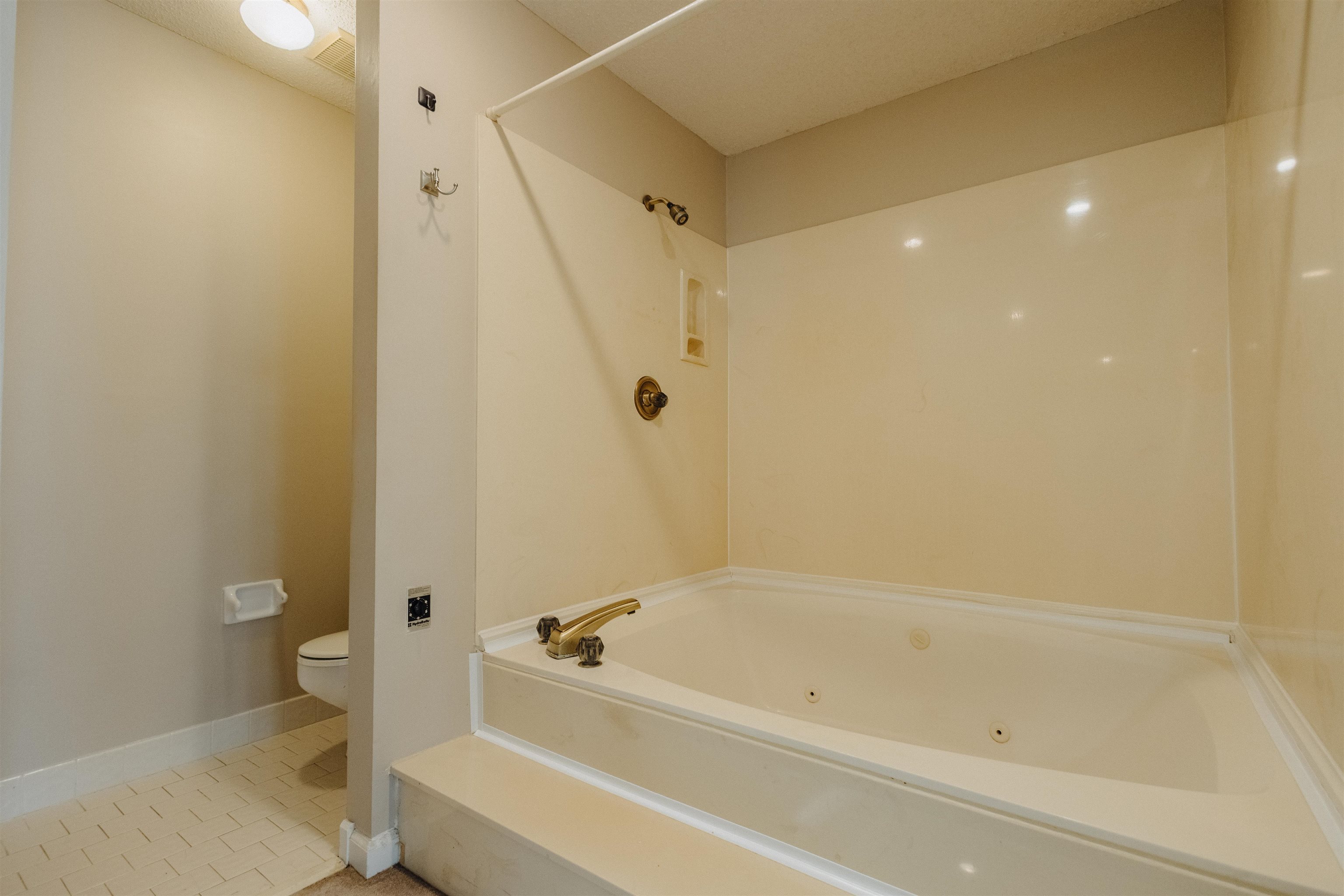 2375 Cherry Spring Cove Memphis, TN 38016 - Photo 22 of 33 a bathroom with a bathtub and a shower