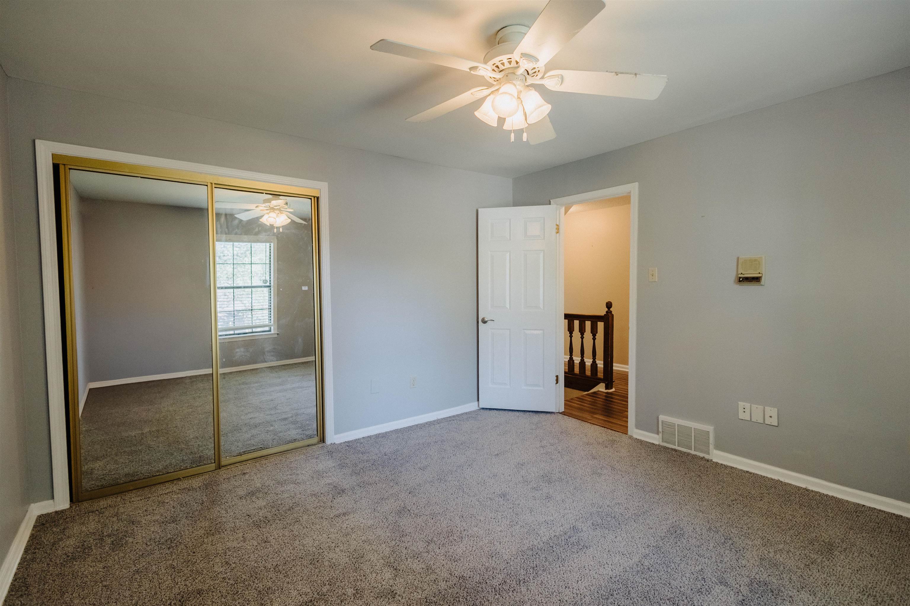 2375 Cherry Spring Cove Memphis, TN 38016 - Photo 24 of 33 an empty room with closet and a ceiling fan