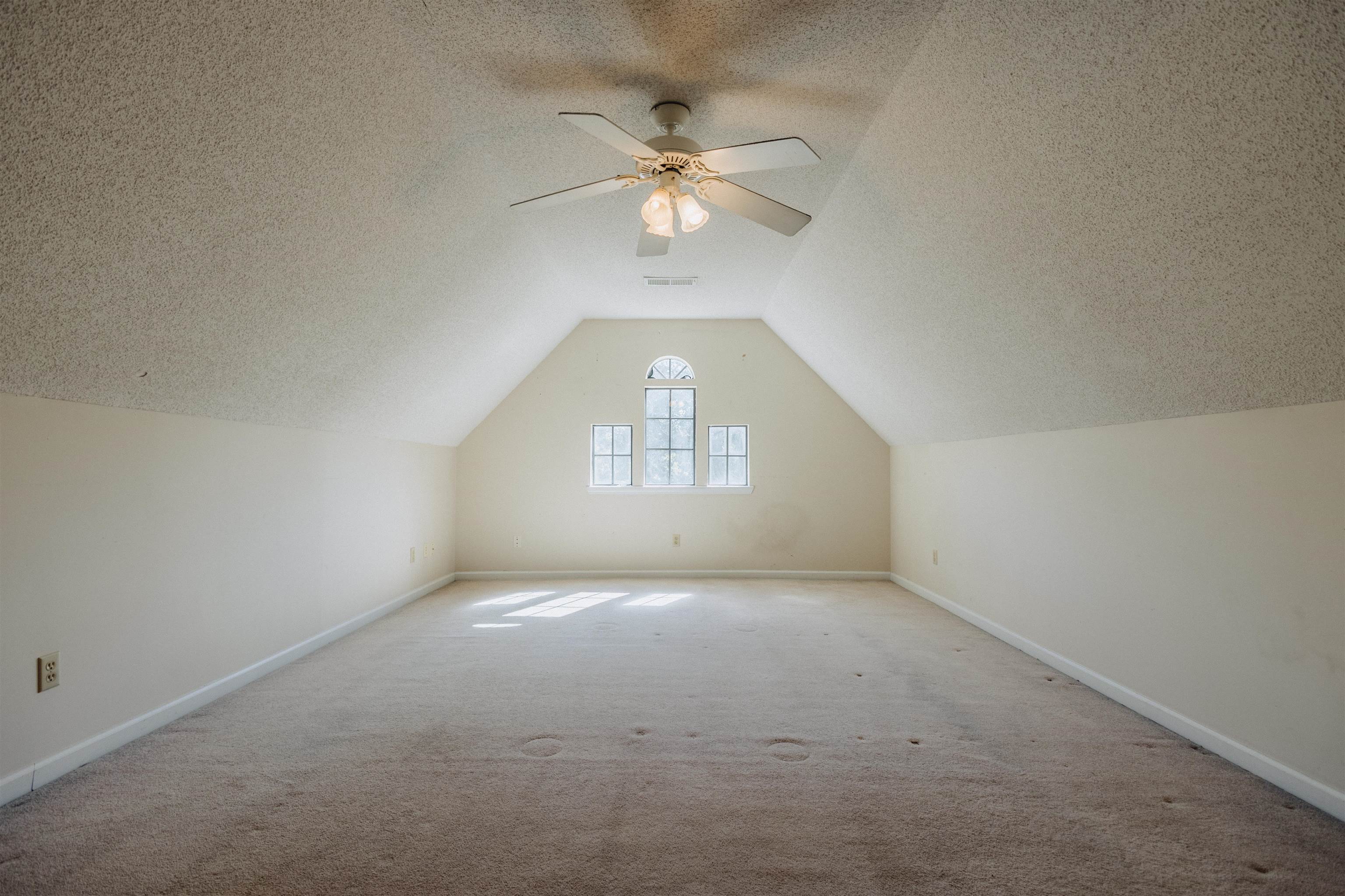 2375 Cherry Spring Cove Memphis, TN 38016 - Photo 29 of 33 an empty room with a fan and a window