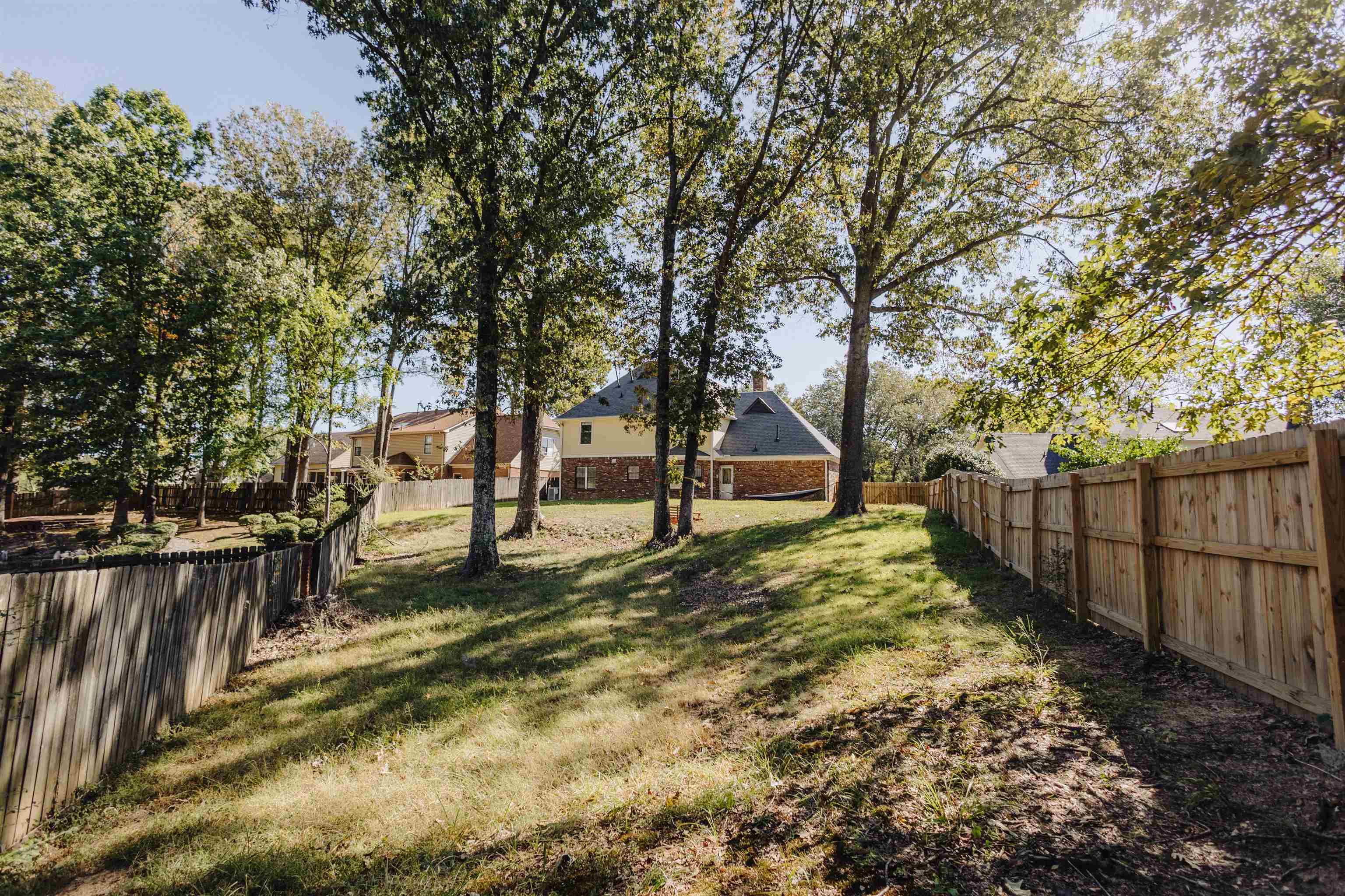 2375 Cherry Spring Cove Memphis, TN 38016 - Photo 32 of 33 a view of a yard with wooden fence