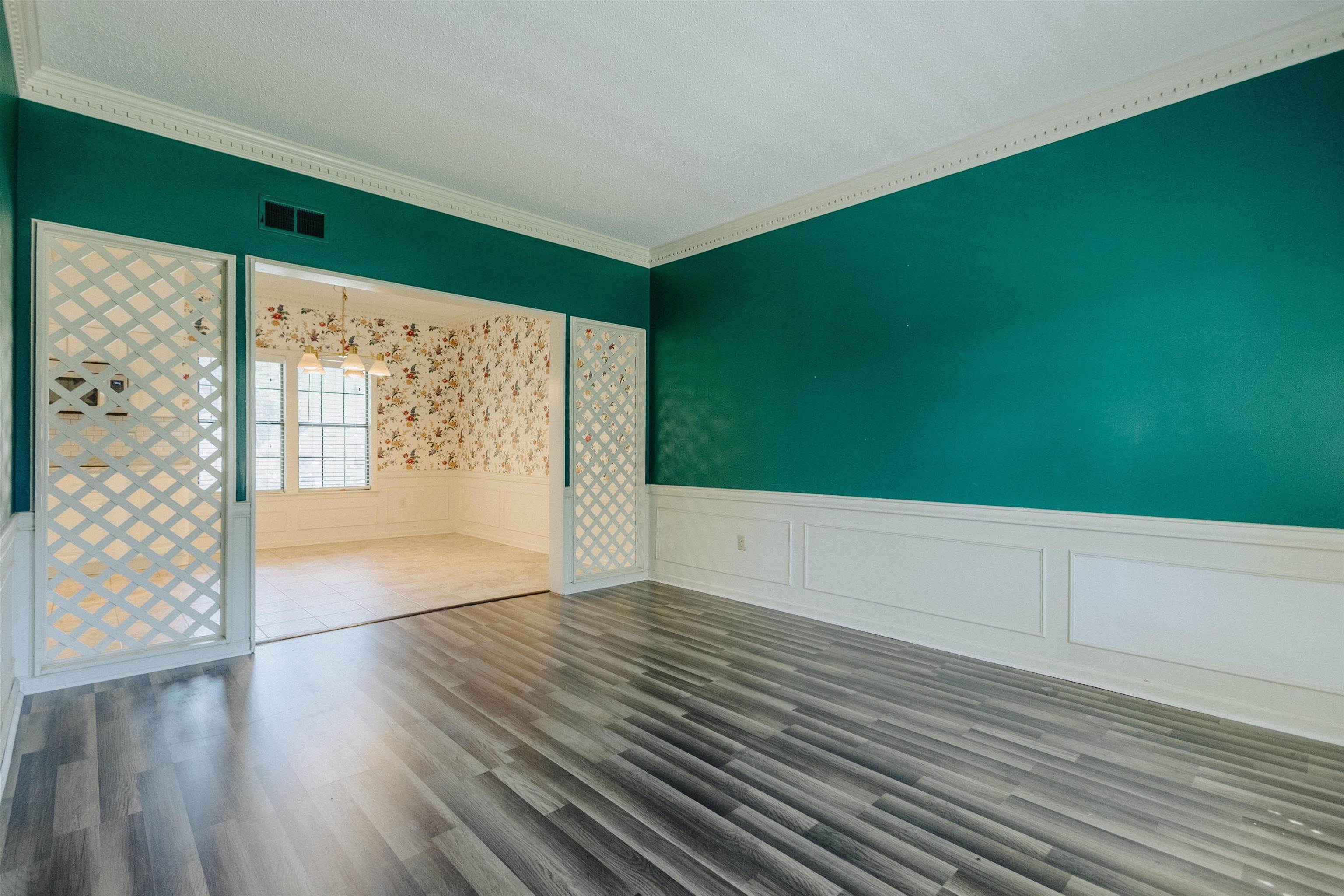 2375 Cherry Spring Cove Memphis, TN 38016 - Photo 6 of 33 a view of an empty room with wooden floor and a window