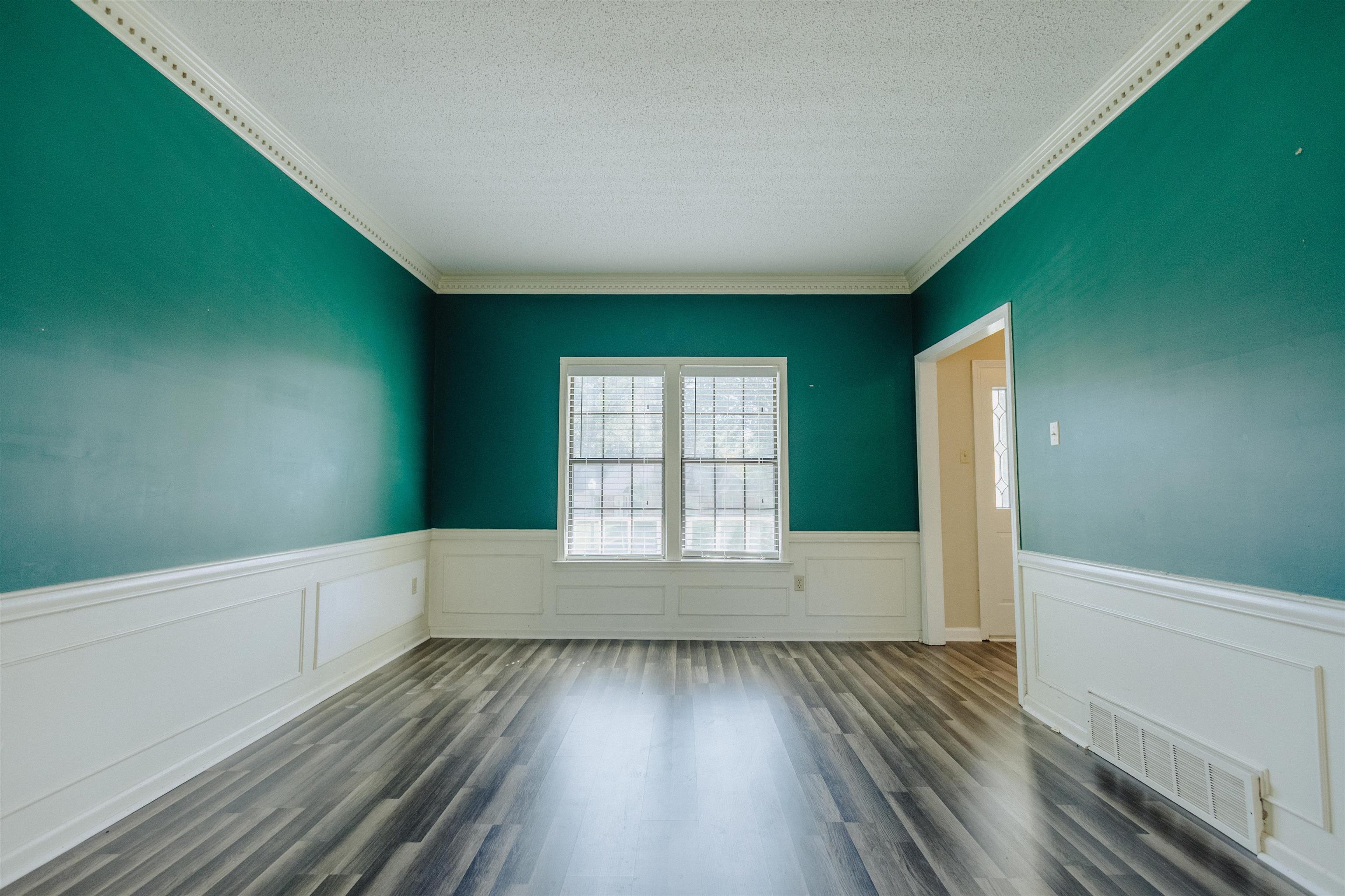 2375 Cherry Spring Cove Memphis, TN 38016 - Photo 7 of 33 a view of an empty room with wooden floor and a window