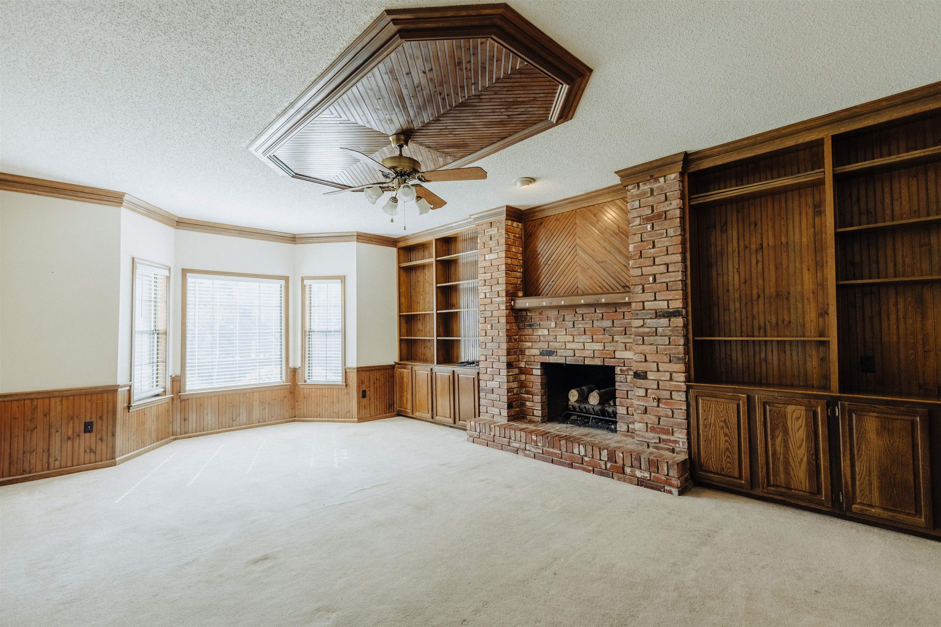 2375 Cherry Spring Cove Memphis, TN 38016 - Photo 9 of 33 a view of a livingroom with furniture and a fireplace