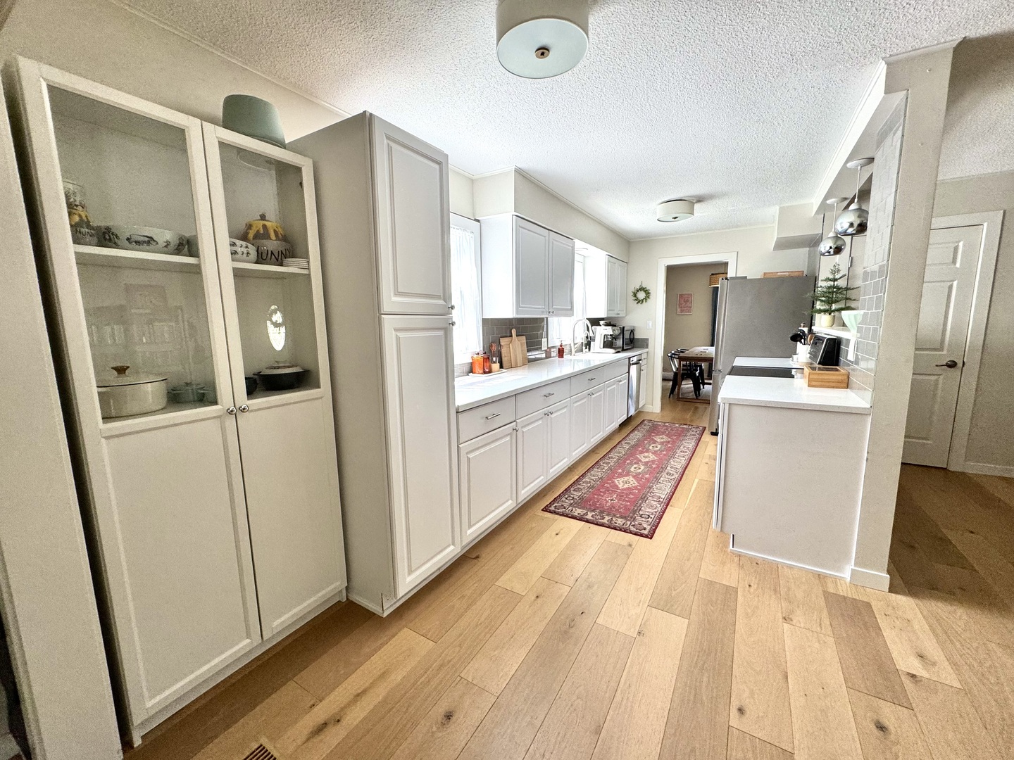 2902 South Myra Ridge Drive Urbana, IL 61802 - Photo 20 of 39 a kitchen with sink refrigerator and wooden floor