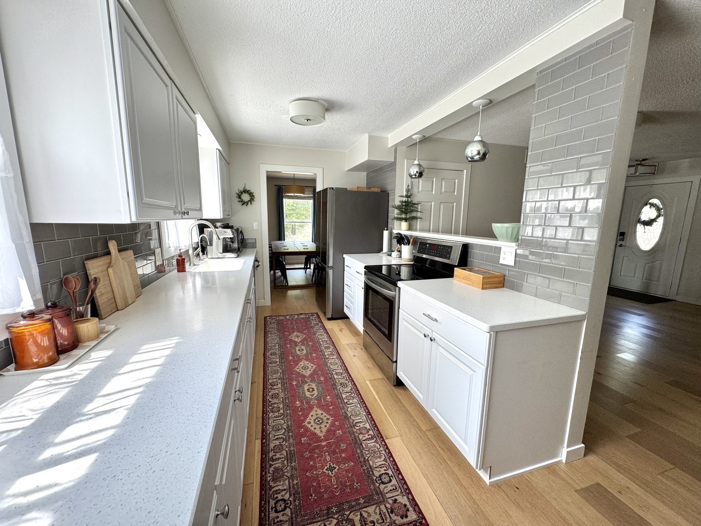 2902 South Myra Ridge Drive Urbana, IL 61802 - Photo 21 of 39 a large white kitchen with stainless steel appliances
