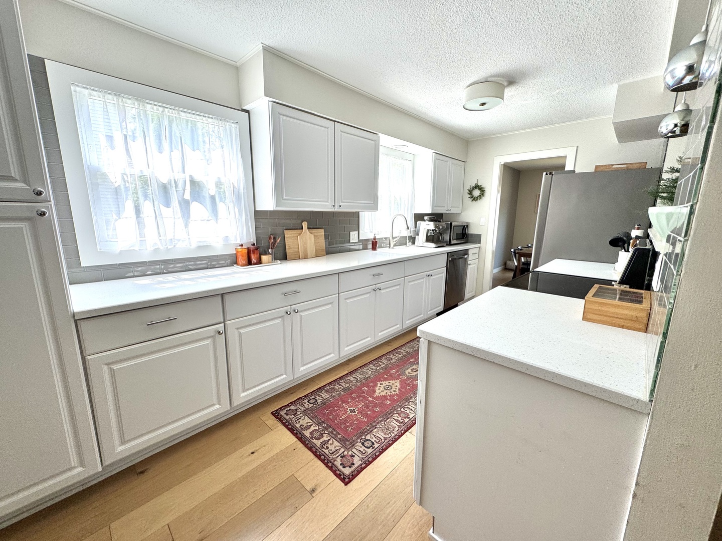 2902 South Myra Ridge Drive Urbana, IL 61802 - Photo 22 of 39 a kitchen with a sink cabinets and wooden floor