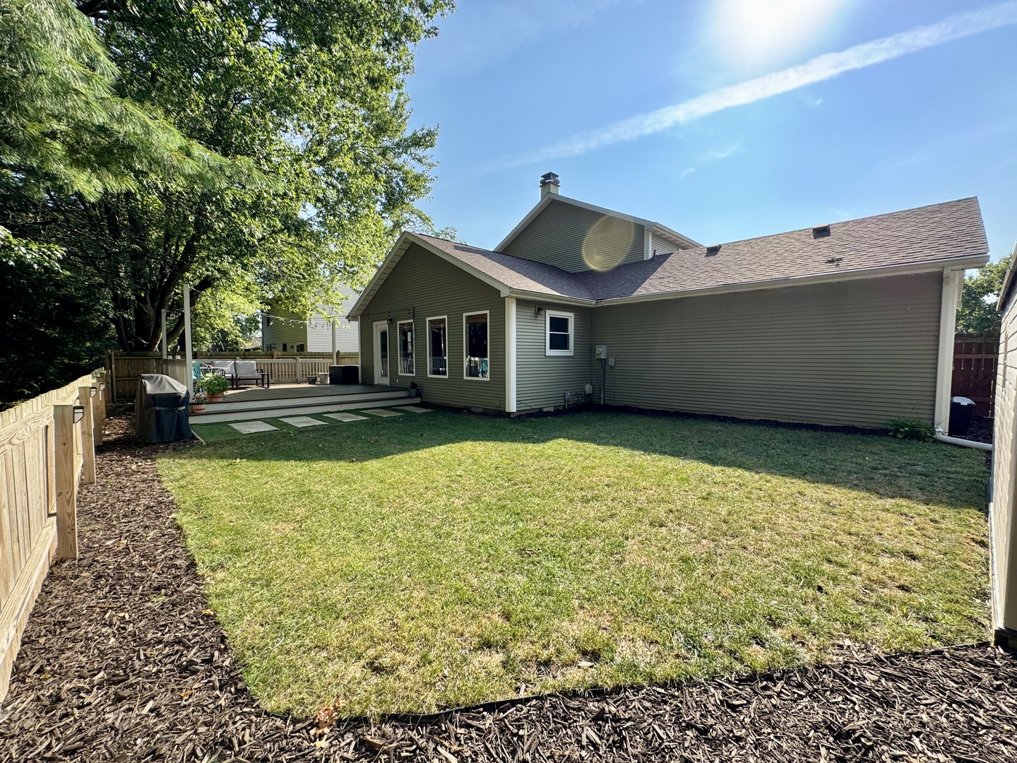 2902 South Myra Ridge Drive Urbana, IL 61802 - Photo 7 of 39 a front view of a house with a garden and yard