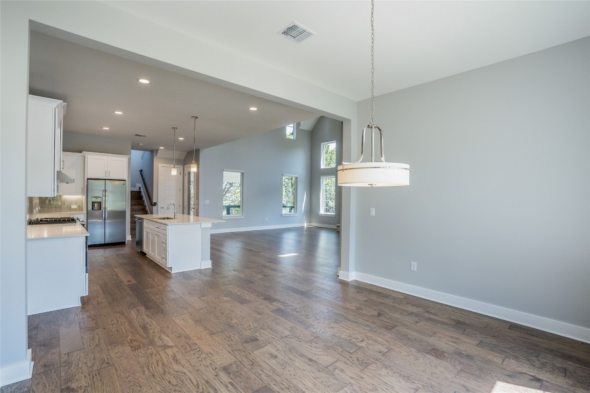 3018 Sunridge Drive, Unit 4 Austin, TX 78741 - Photo 11 of 34 a view of a kitchen with cabinets appliances and a ceiling fan