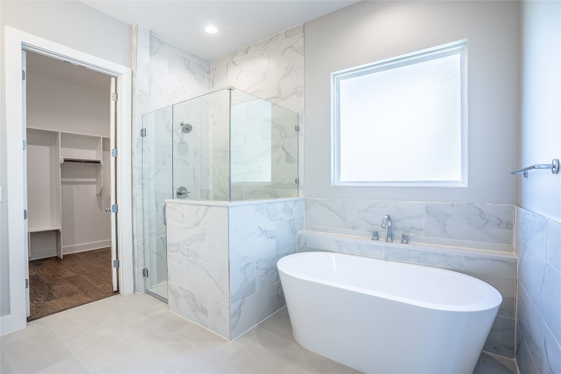 3018 Sunridge Drive, Unit 4 Austin, TX 78741 - Photo 17 of 34 a white bath tub sitting in a bathroom and bathroom