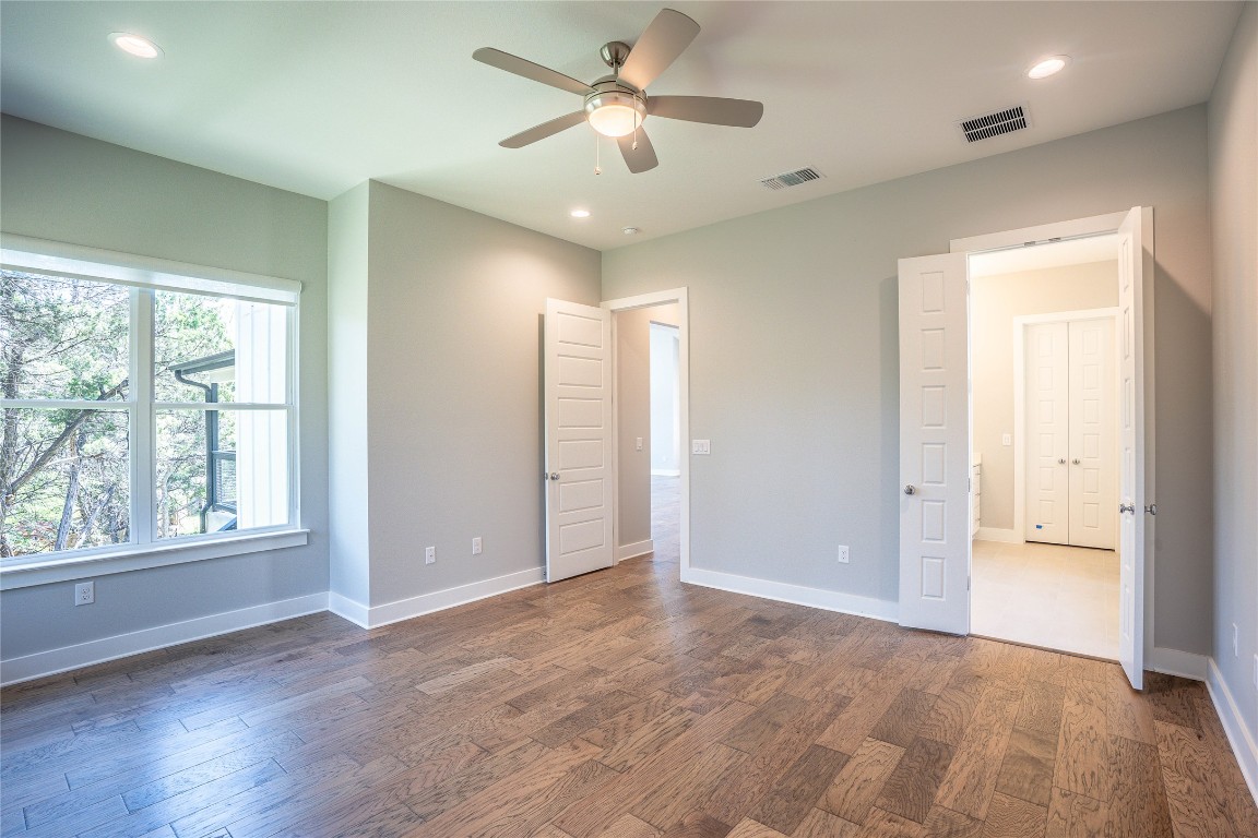 3018 Sunridge Drive, Unit 4 Austin, TX 78741 - Photo 20 of 34 a view of empty room with wooden floor and fan