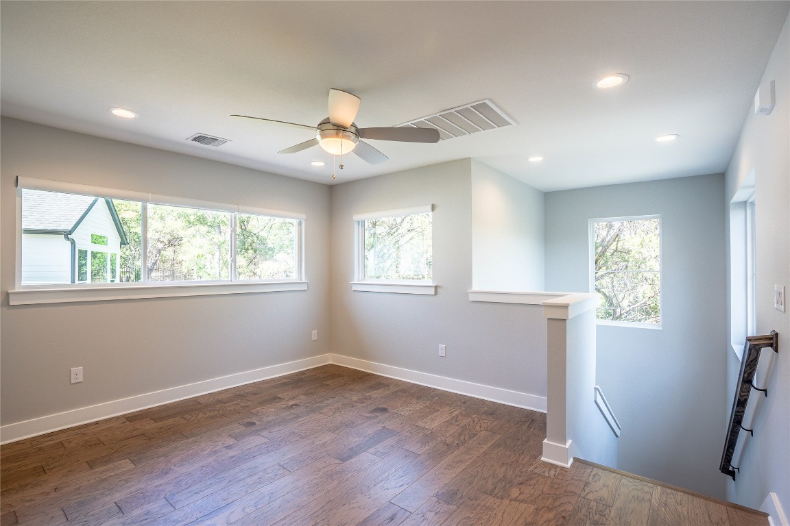 3018 Sunridge Drive, Unit 4 Austin, TX 78741 - Photo 27 of 34 a view of empty room with wooden floor and fan
