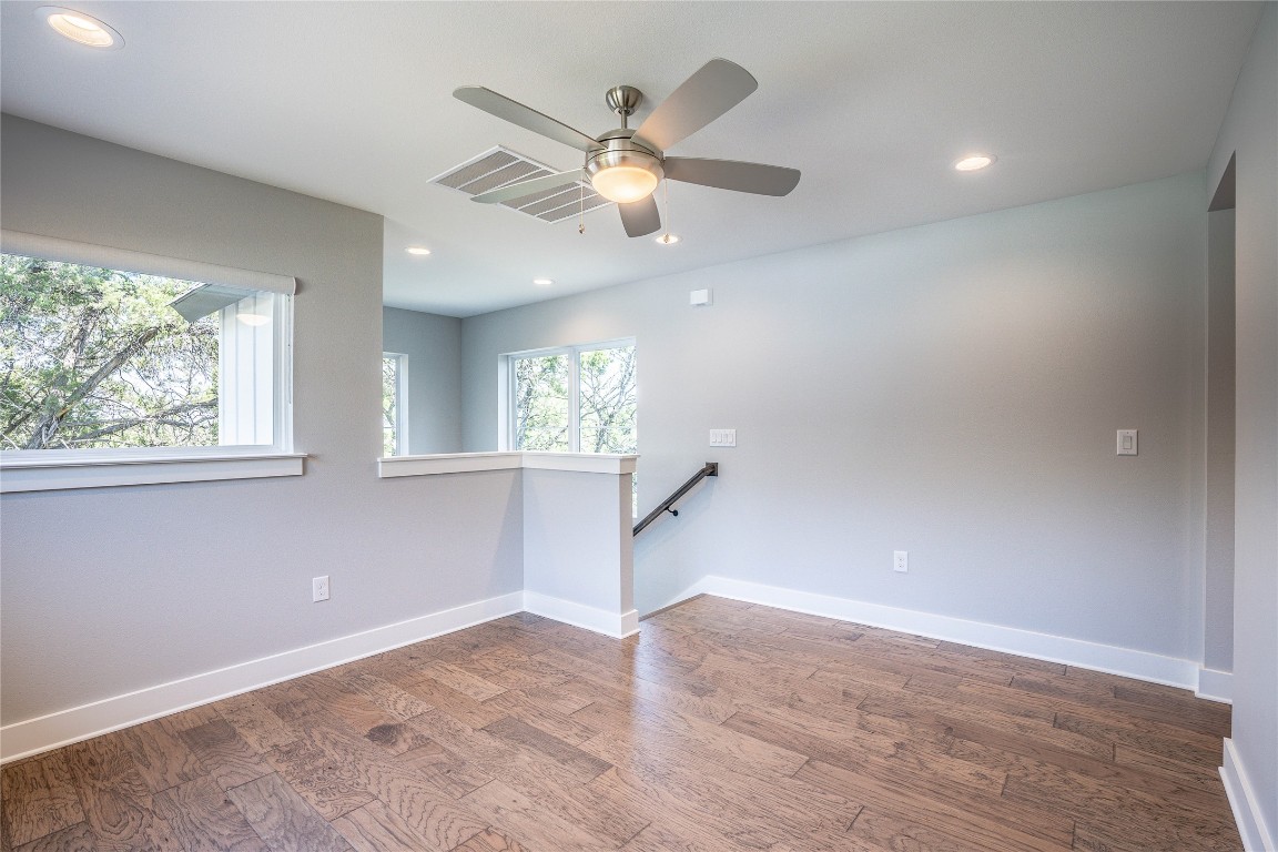 3018 Sunridge Drive, Unit 4 Austin, TX 78741 - Photo 29 of 34 wooden floor in an empty room with a window