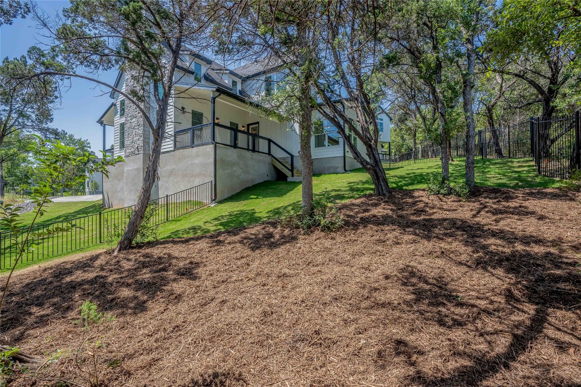 3018 Sunridge Drive, Unit 4 Austin, TX 78741 - Photo 31 of 34 a backyard of a house with lots of green space