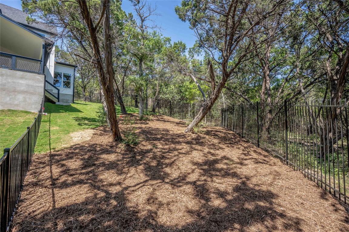 3018 Sunridge Drive, Unit 4 Austin, TX 78741 - Photo 32 of 34 a view of a tree in a yard