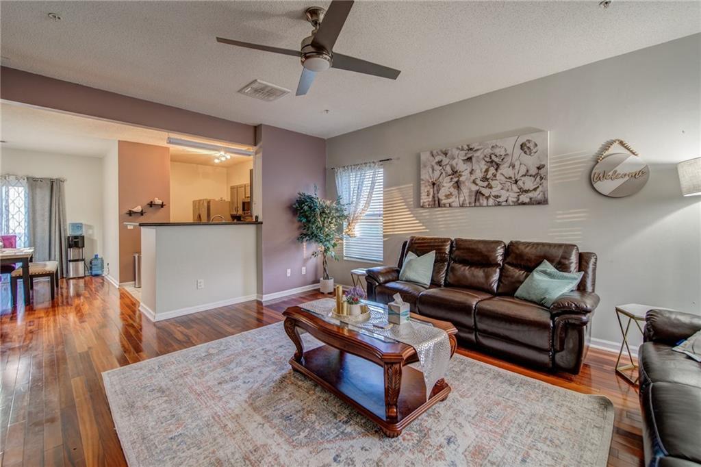 2829 Laurel Ridge Circle East Point, GA 30344 - Photo 1 of 1 a living room with furniture and wooden floor