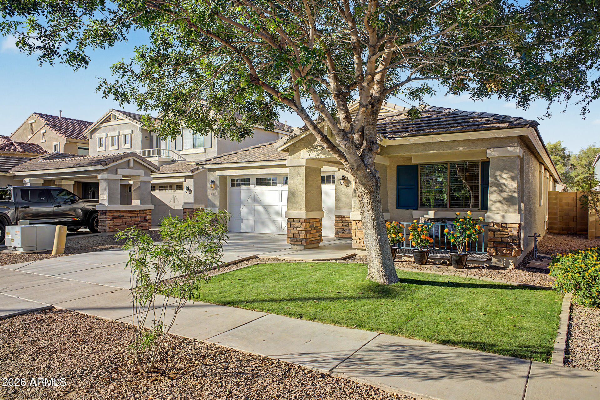 4168 East Sandy Way Gilbert, AZ 85297 - Photo 3 of 47 a front view of a house with garden
