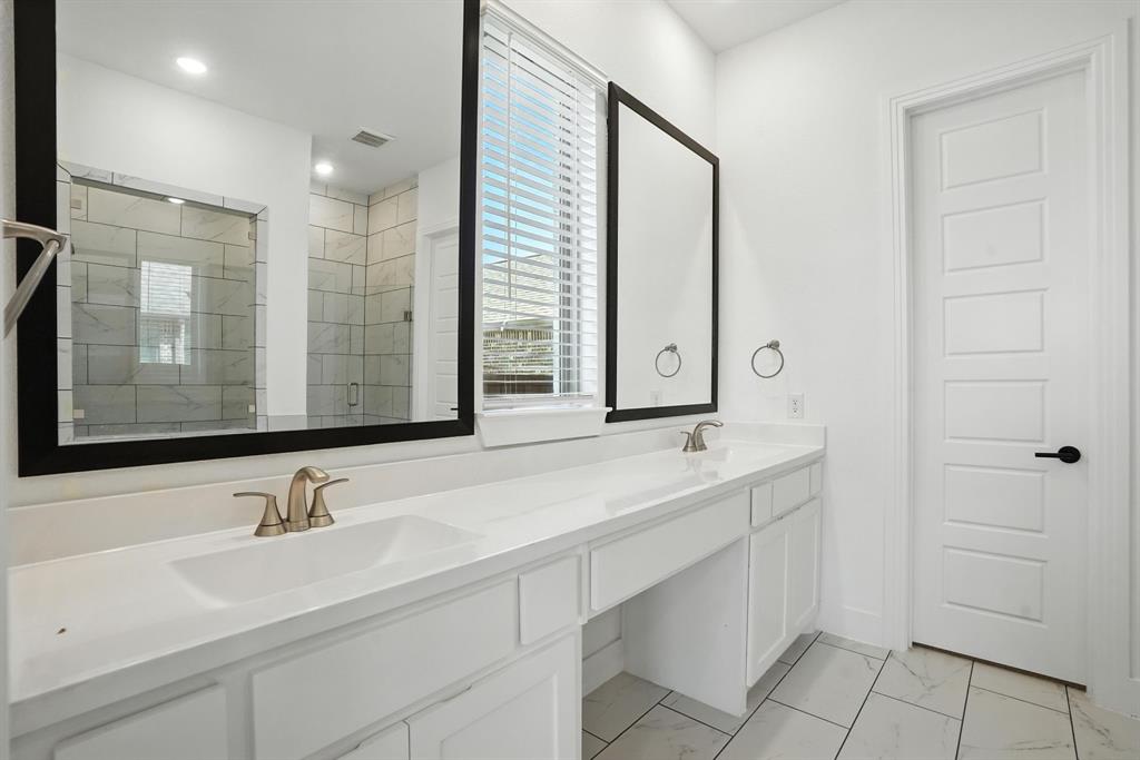 4621 Mount Vista Road Oak Point, TX 75068 - Photo 20 of 40 a bathroom with a sink and a mirror