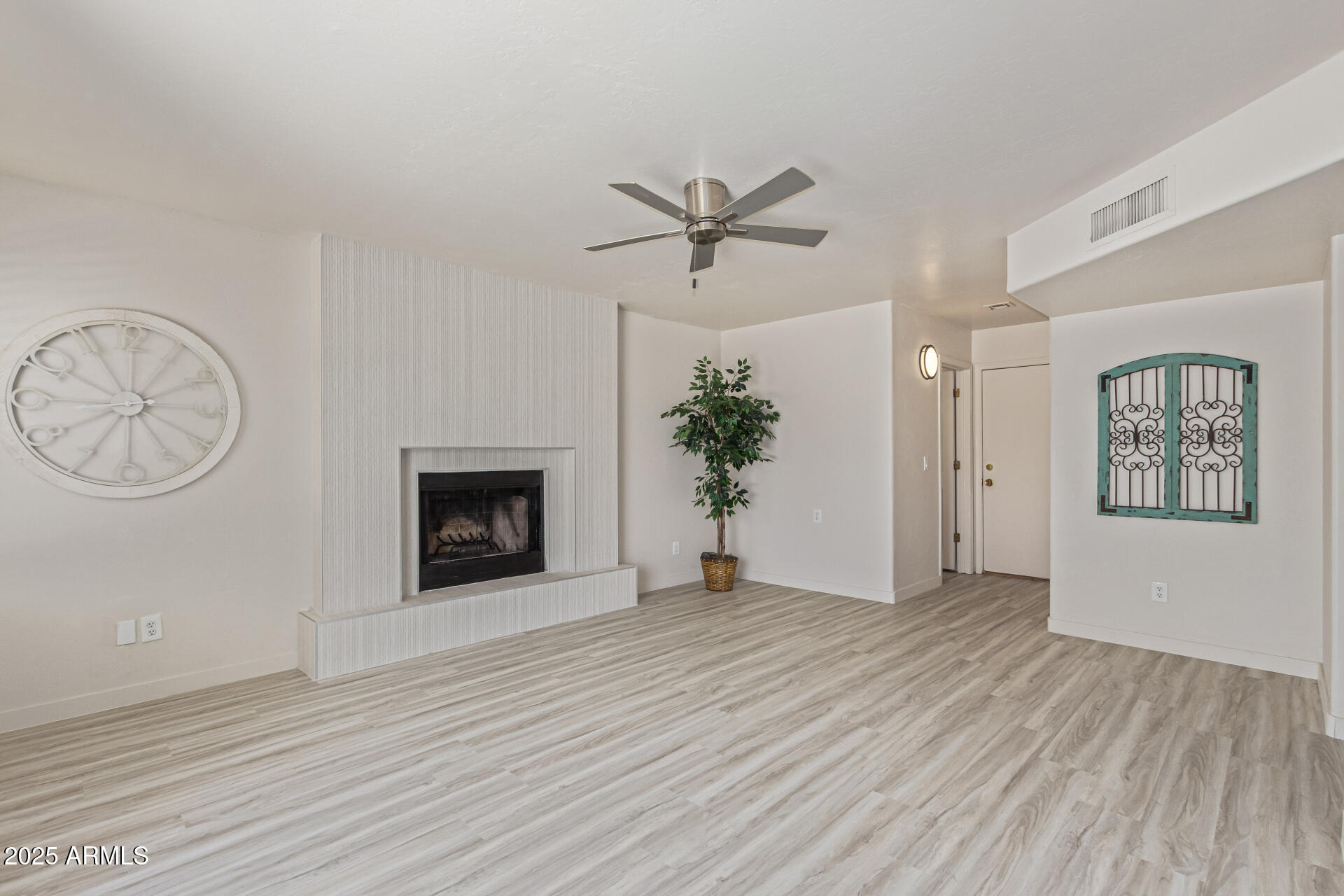 4933 East Downing Street Mesa, AZ 85205 - Photo 13 of 44 a view of an empty room with a window and fireplace