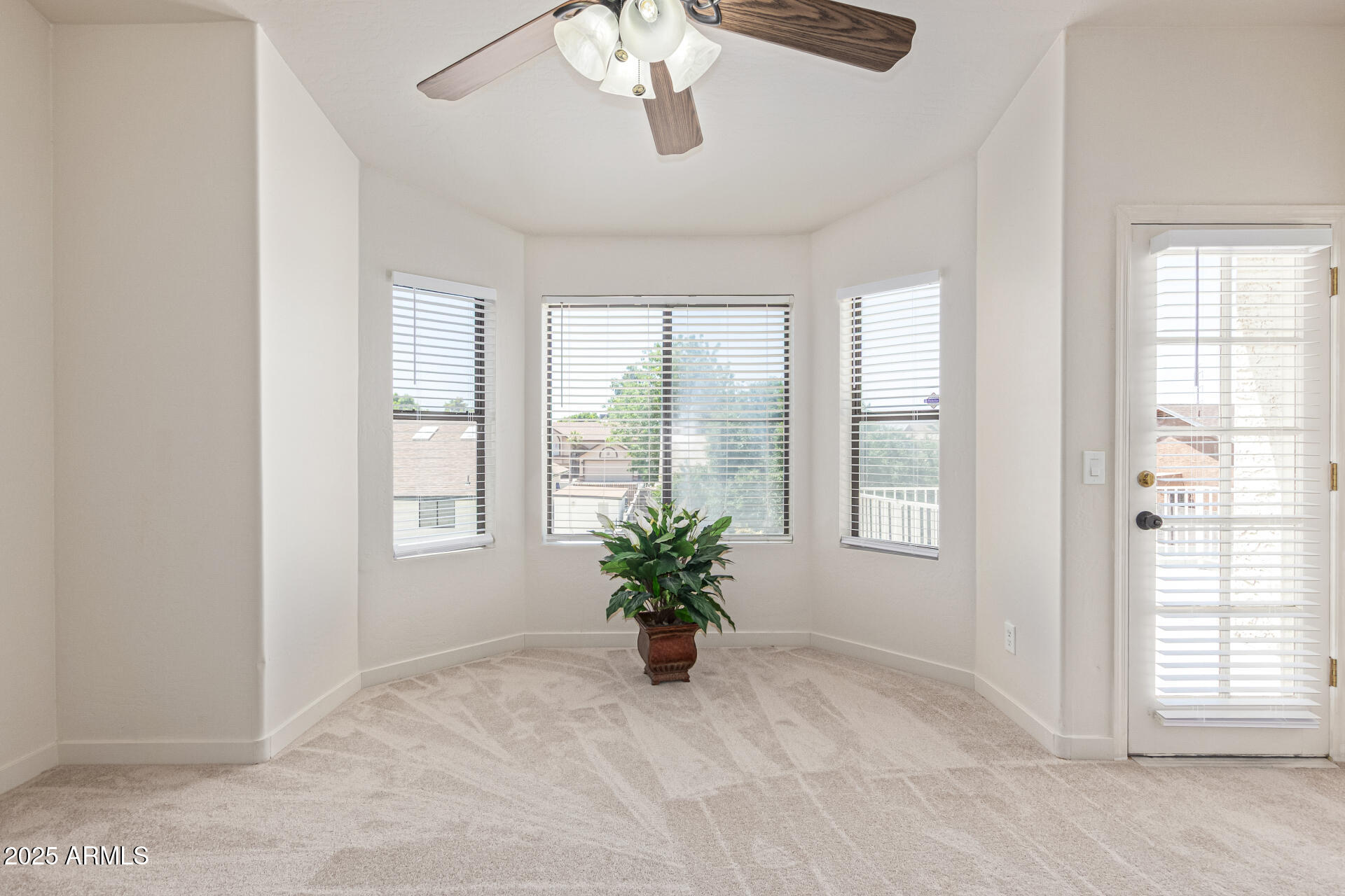 4933 East Downing Street Mesa, AZ 85205 - Photo 22 of 44 a view of an empty room with a window