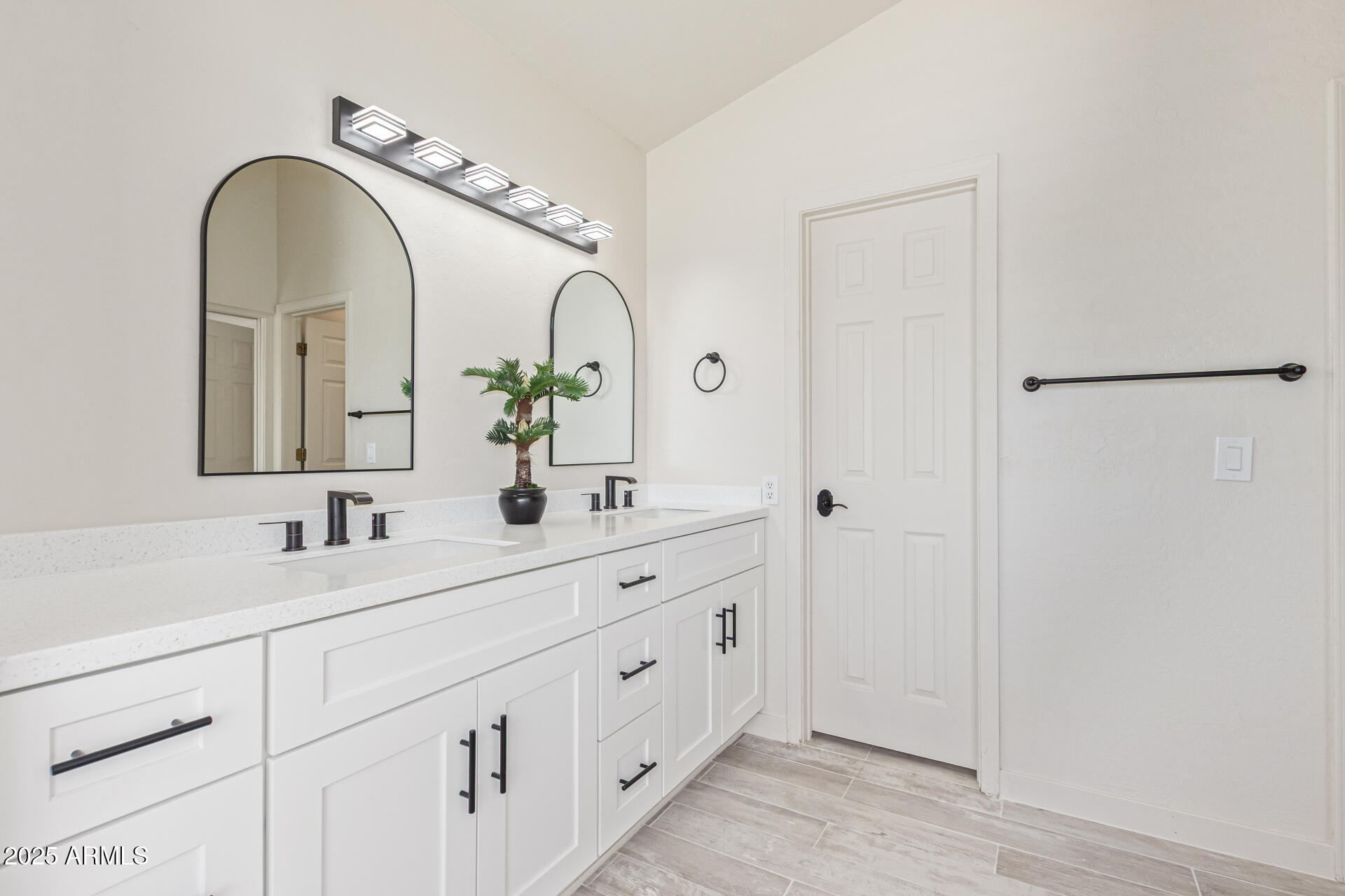 4933 East Downing Street Mesa, AZ 85205 - Photo 23 of 44 a bathroom with a double vanity sink and a mirror