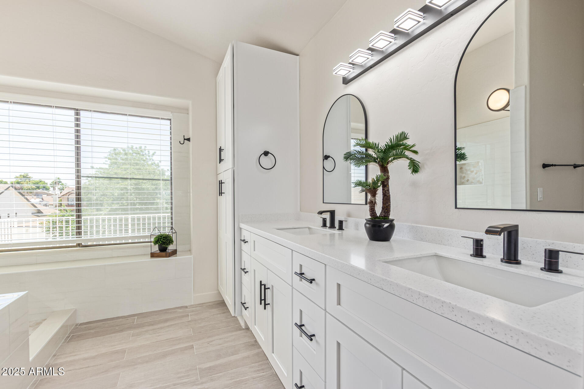 4933 East Downing Street Mesa, AZ 85205 - Photo 25 of 44 a bathroom with a double vanity sink and a mirror
