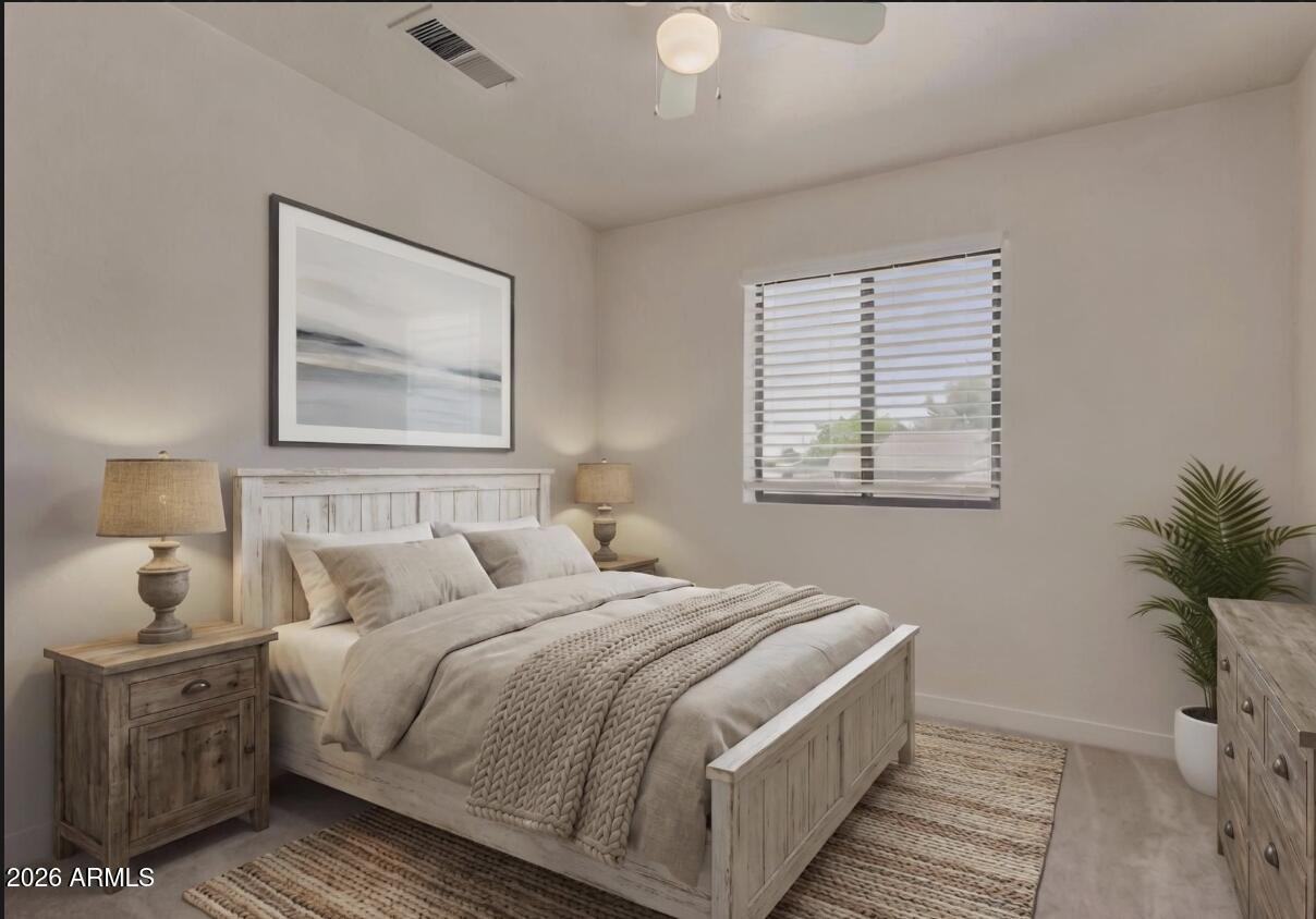 4933 East Downing Street Mesa, AZ 85205 - Photo 27 of 44 a bedroom with bed and wooden floor