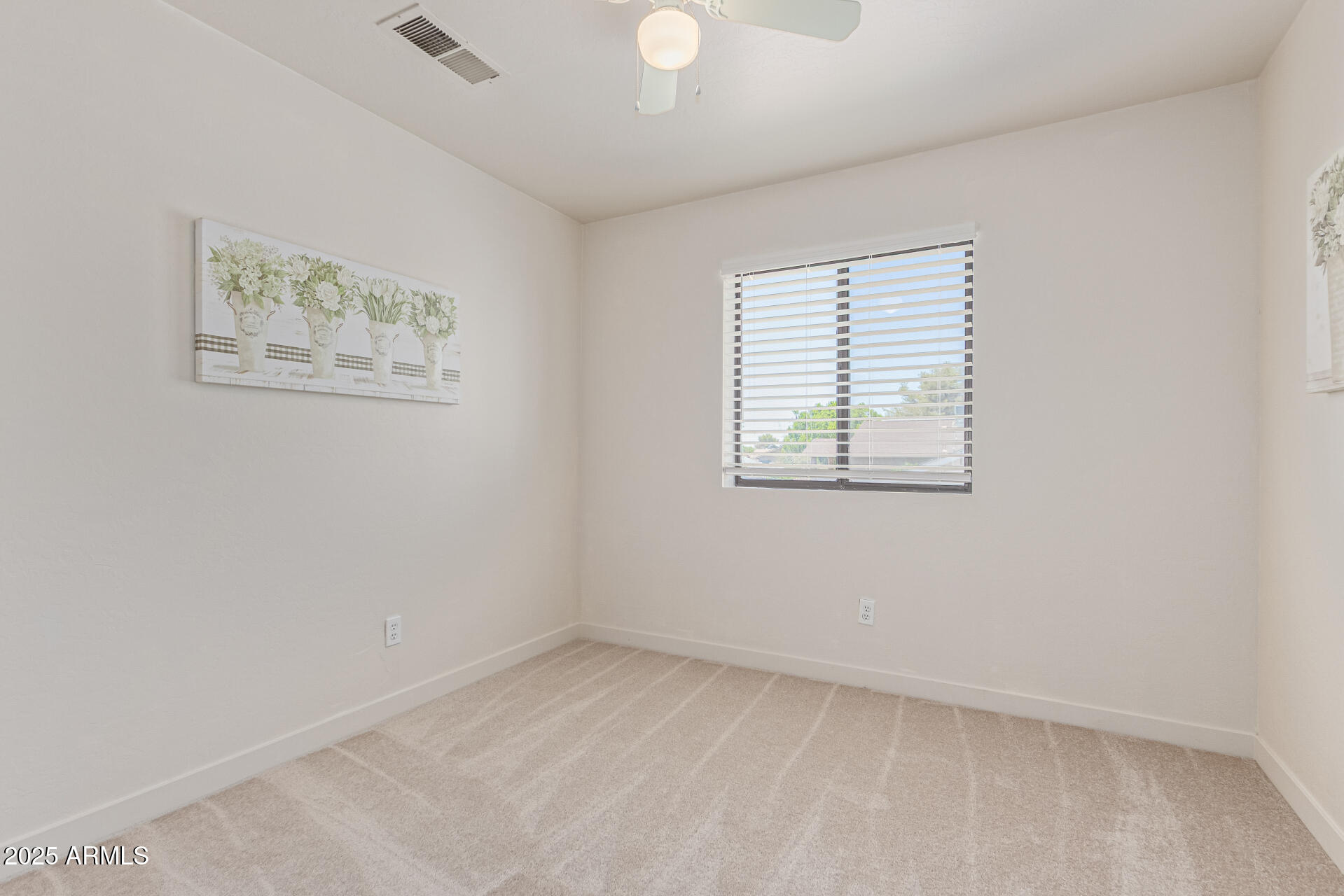 4933 East Downing Street Mesa, AZ 85205 - Photo 28 of 44 an empty room with a window