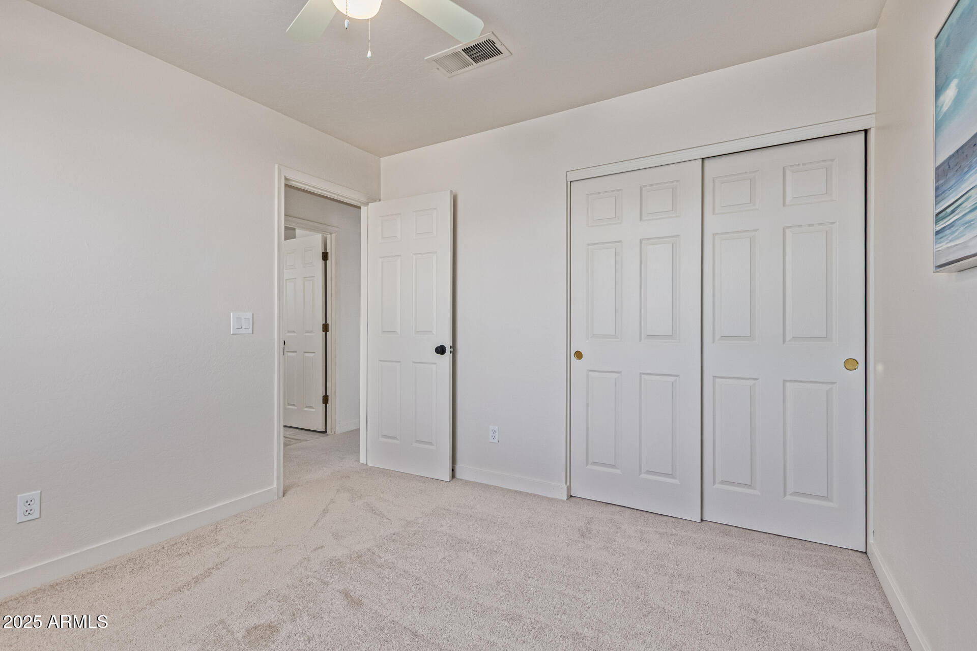 4933 East Downing Street Mesa, AZ 85205 - Photo 33 of 44 a view of an empty room and chandelier fan