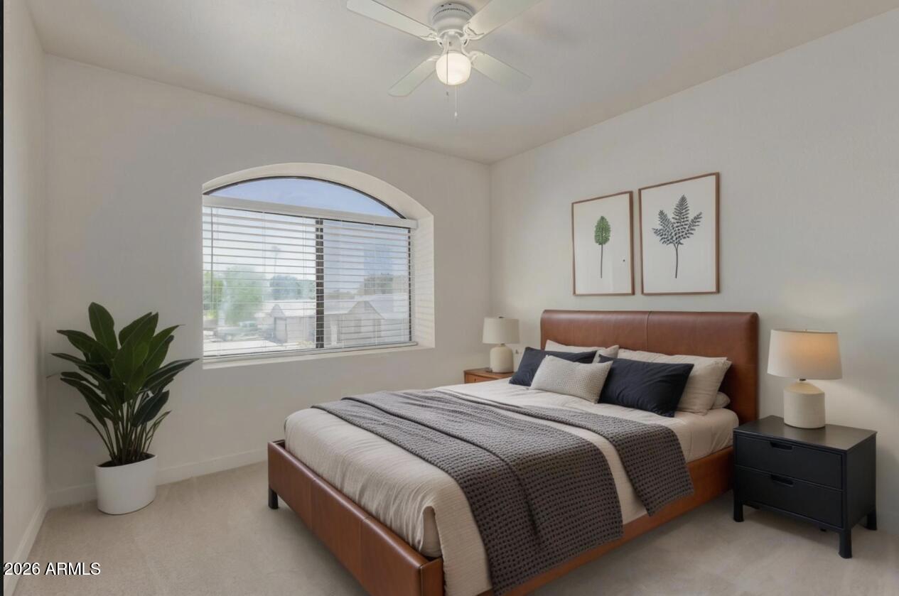 4933 East Downing Street Mesa, AZ 85205 - Photo 35 of 44 a bedroom with a large bed and a large window