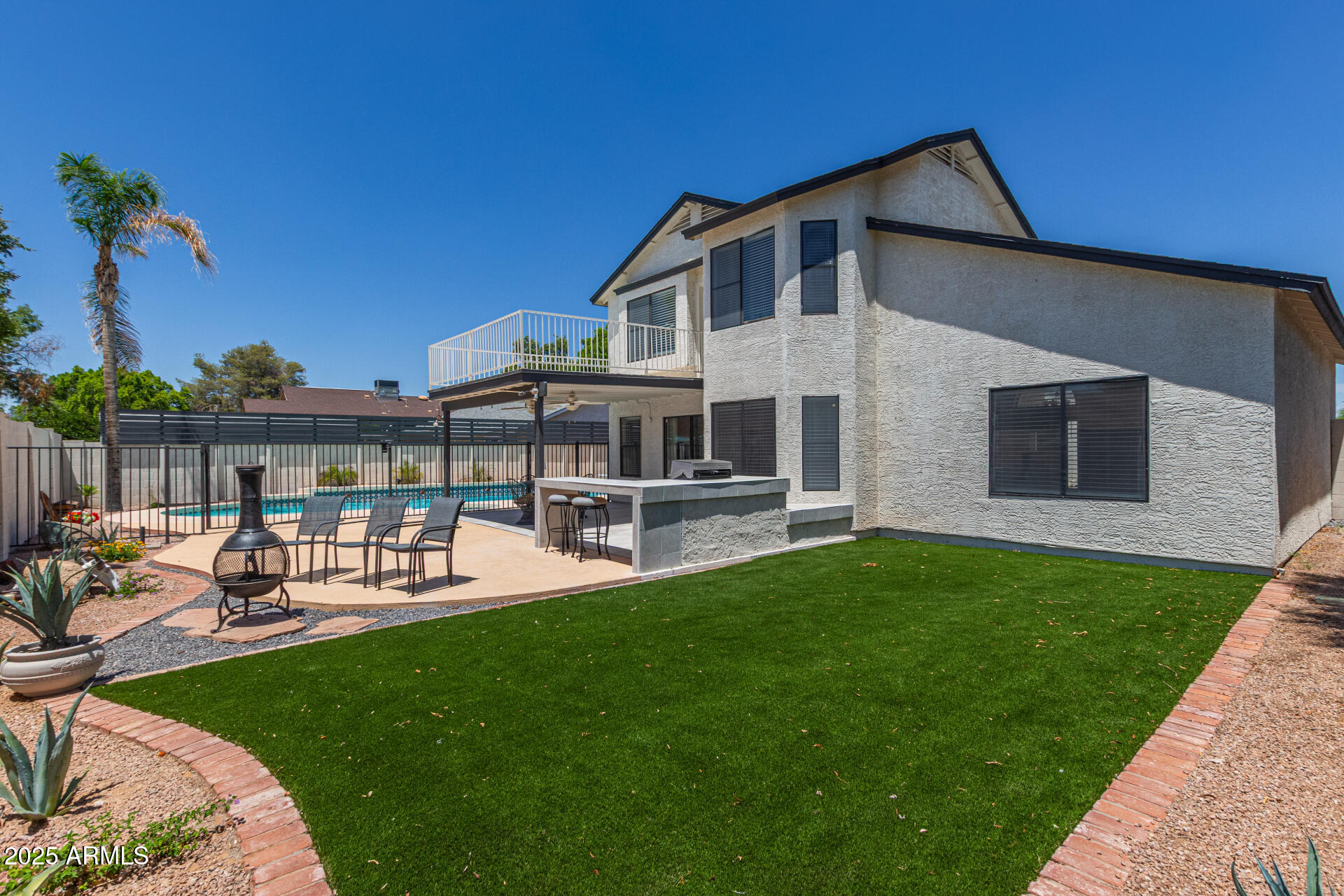 4933 East Downing Street Mesa, AZ 85205 - Photo 41 of 44 a front view of house with a garden and patio