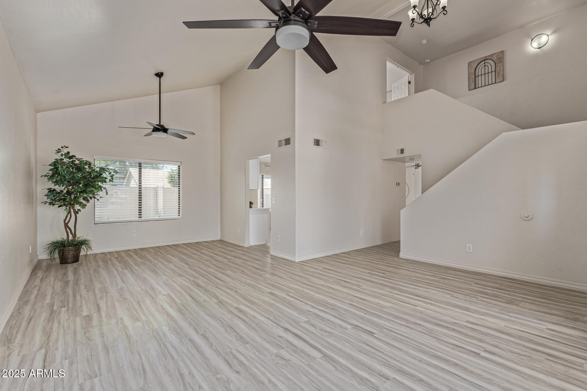 4933 East Downing Street Mesa, AZ 85205 - Photo 8 of 44 a view of an entryway with a chandelier