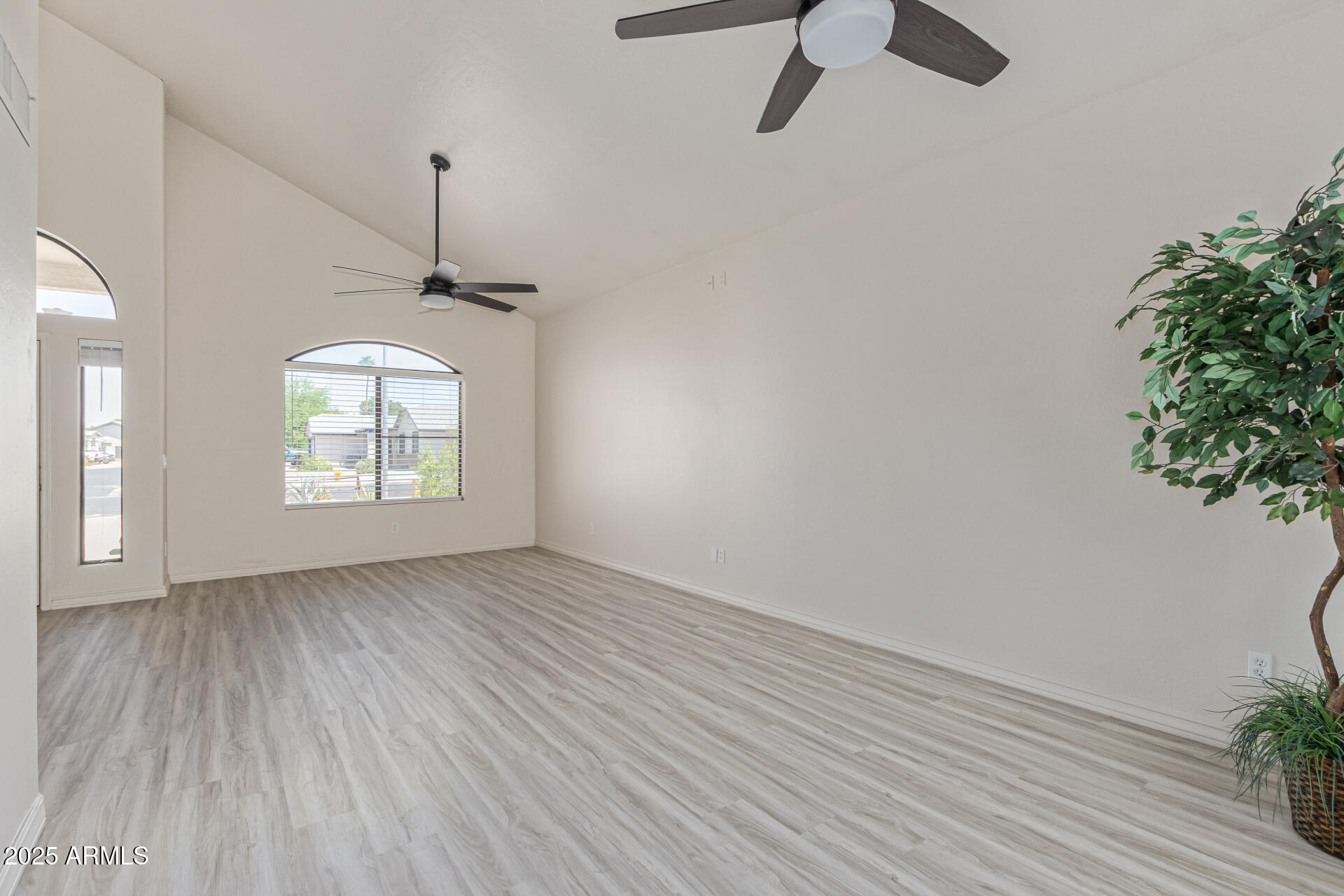 4933 East Downing Street Mesa, AZ 85205 - Photo 10 of 44 wooden floor in an empty room with a window