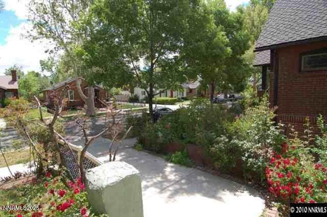 611 Nixon Avenue Reno, NV 89509 - Photo 39 of 43 a backyard of a house with lots of green space and plants
