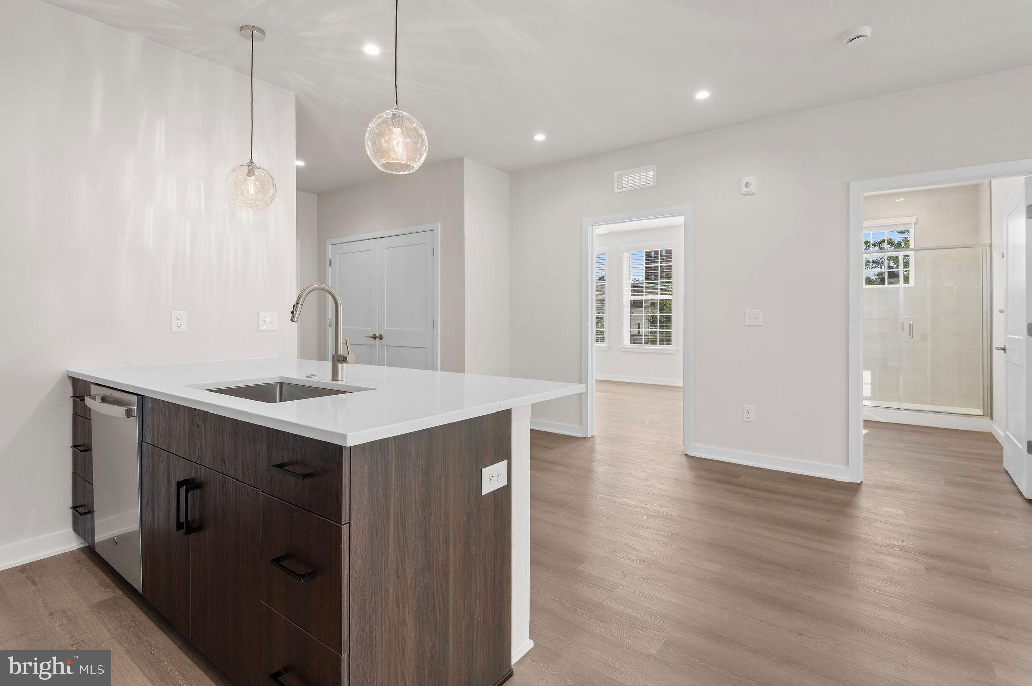 26 South York Road, Unit 209 Hatboro, PA 19040 - Photo 11 of 51 a kitchen with a sink and chandelier