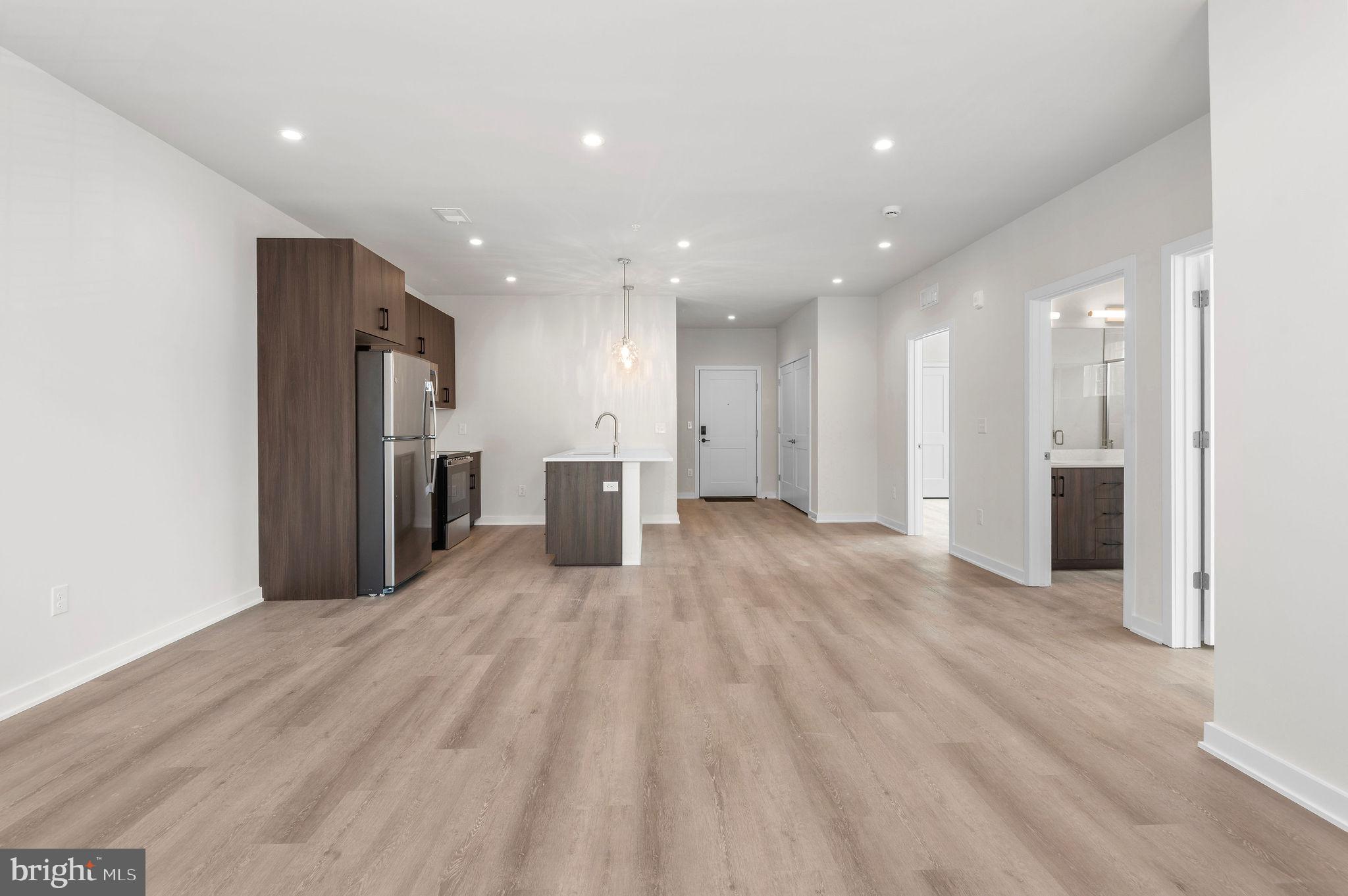 26 South York Road, Unit 209 Hatboro, PA 19040 - Photo 16 of 51 a view of an empty room with a refrigerator