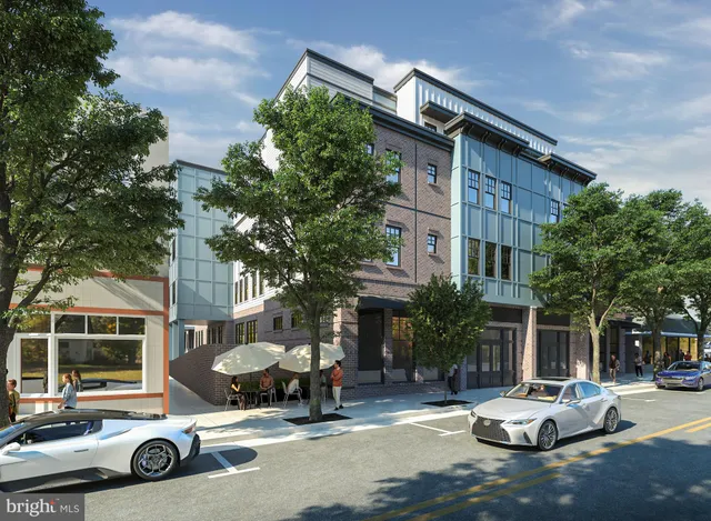 a view of a cars park in front of a building