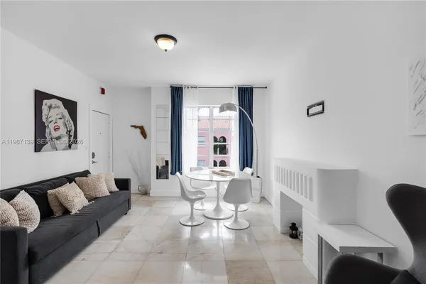 a living room with furniture and a large window