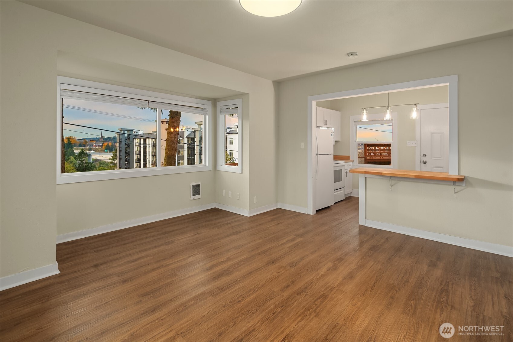 403 East Wright Avenue Tacoma, WA 98404 - Photo 11 of 29 wooden floor in an empty room with a window