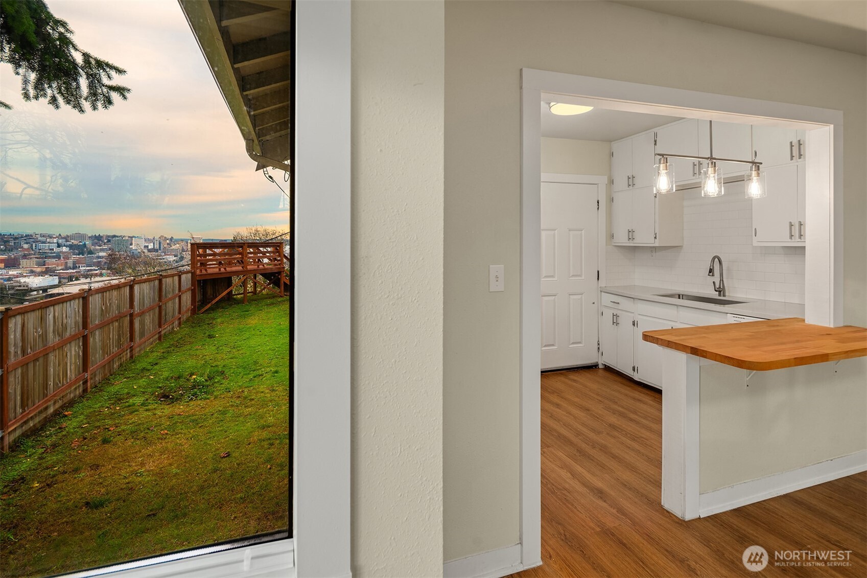 403 East Wright Avenue Tacoma, WA 98404 - Photo 12 of 29 a bathroom with a sink a mirror and a shower
